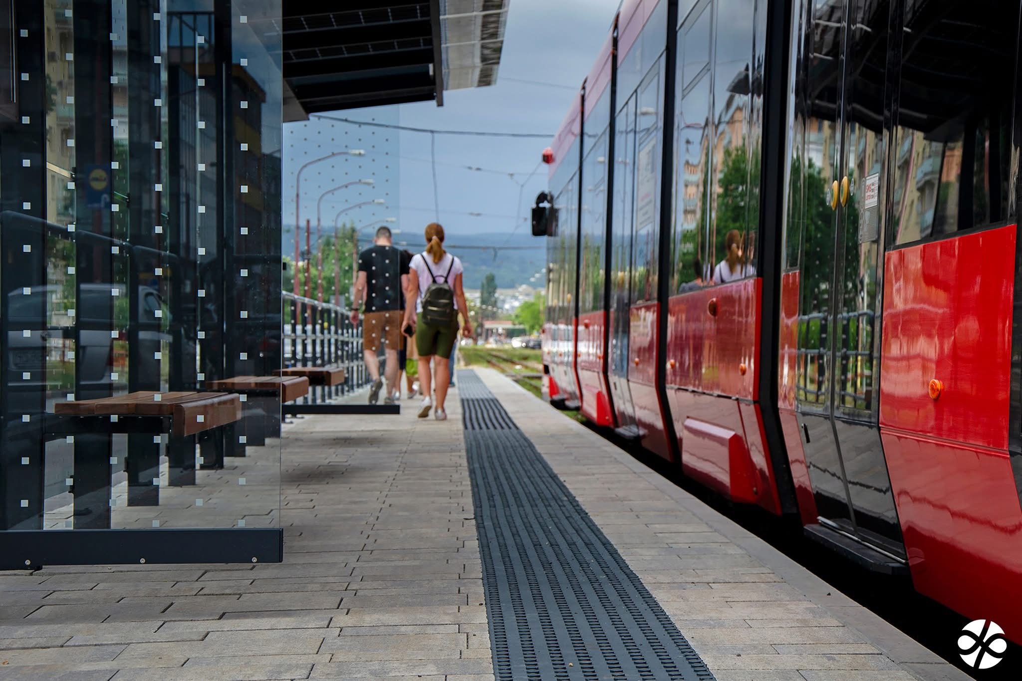 Accessible bus with lowering system and ramp deployed